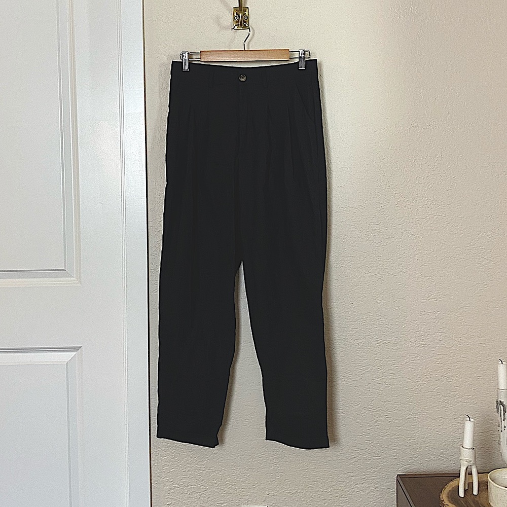 Black business parent with front creased detail. Never worn. Good condition.